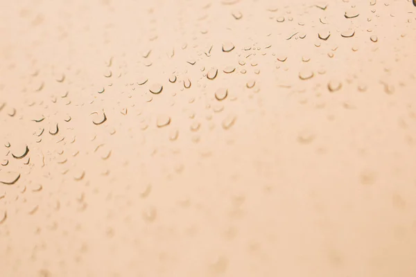 Raindrops on window glass,condensation on the window,natural background,color texture,abstract and pattern