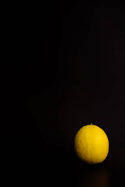 fresh lemon on black background