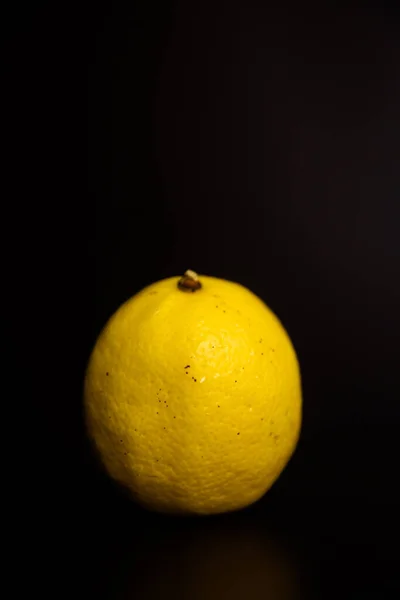 fresh lemon on black background