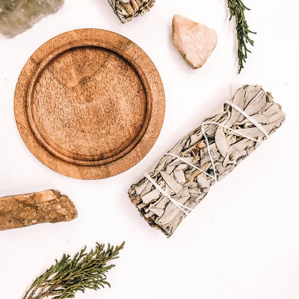 Natural incense White Sage and Palo Santo. Sacred tree of South America, color square photo.White Sage and Palo Santo on white background.