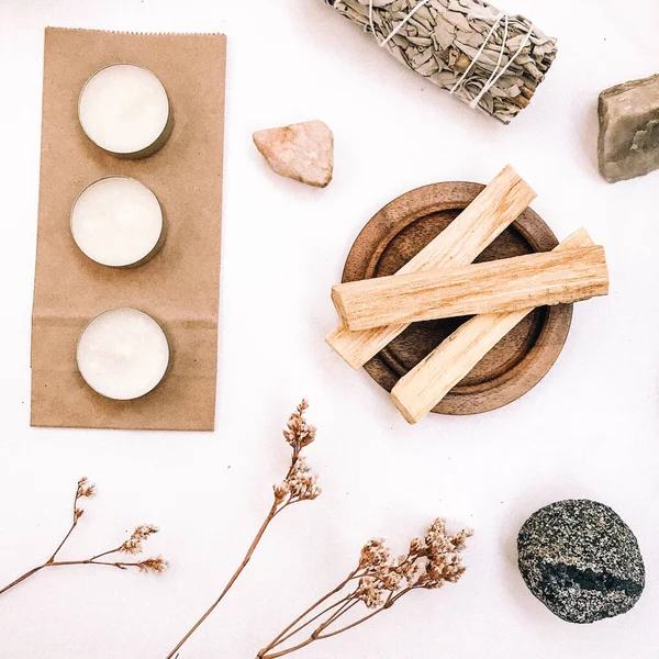 Natural incense White Sage and Palo Santo. Sacred tree of South America, color square photo.White Sage and Palo Santo on white background.