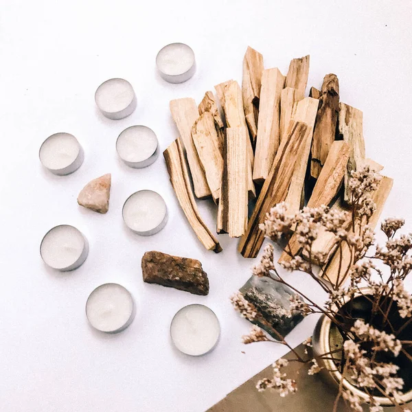 Natural incense White Sage and Palo Santo. Sacred tree of South America, color square photo.White Sage and Palo Santo on white background.