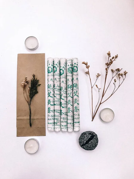 Natural incense White Sage and Palo Santo. Sacred tree of South America, color square photo.White Sage and Palo Santo on white background.