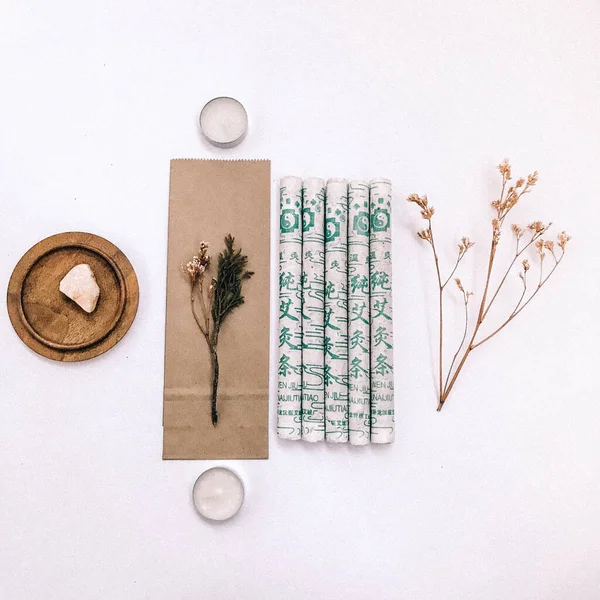 Natural incense White Sage and Palo Santo. Sacred tree of South America, color square photo.White Sage and Palo Santo on white background.