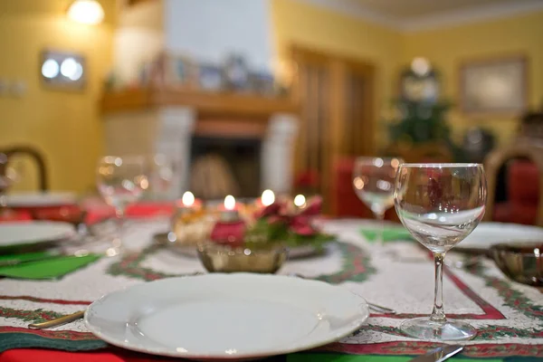 Empty plate with cutlery on the Christmas table.