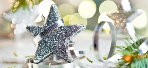 Christmas star and glitter on unfocused background