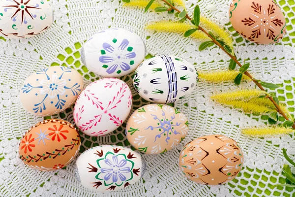 Painted Easter eggs with a blossom on the desk — Stock Photo, Image