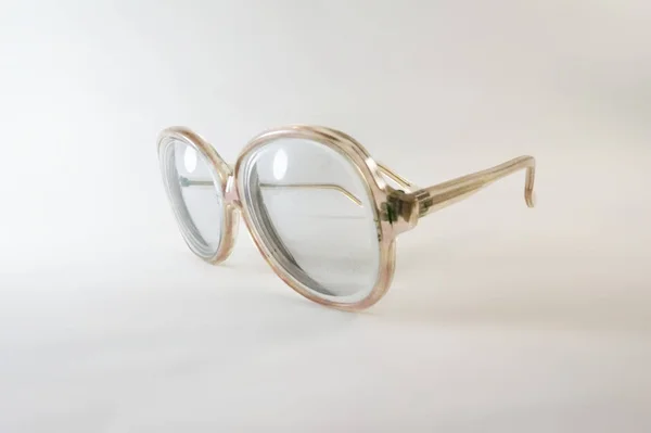 Glasses, Eyeglass frames, Plastic frame, Soviet eyeglass frames, Vintage eyeglass frames, USSR glasses, Old glasses, Transparent, White background, Close-up, Antique glasses, Soviet olden, Grandmother glasses, Optics, headstock stock image, Nostalg