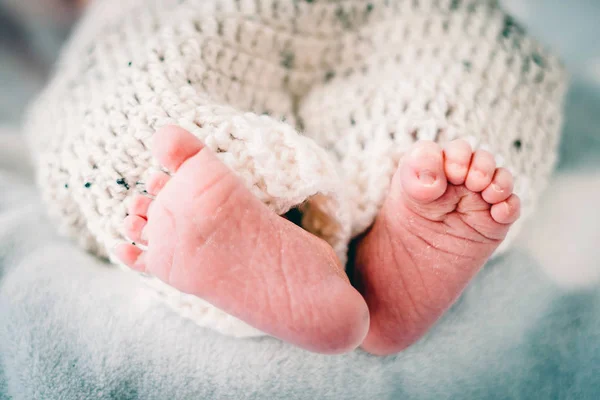 Small foot with dry skin of new born baby boy