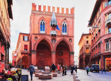 Bologna, Italy - October 21, 2016: People at Palazzo della Mercanzia Palace on Piazza della Mercanzia Square in Bologna, Emilia-Romagna, Italy