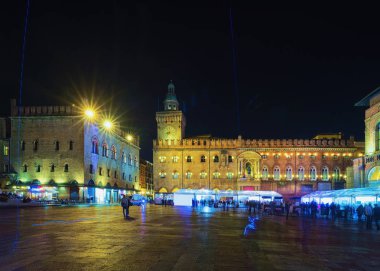 People at Palazzo d Accursio on Piazza Maggiore Square in Bologna, Emilia-Romagna, Italy. Late in the evening clipart