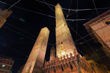 Two towers at Piazza di Porta Ravegnana in Bologna, Emilia-Romagna, Italy. Late at night clipart