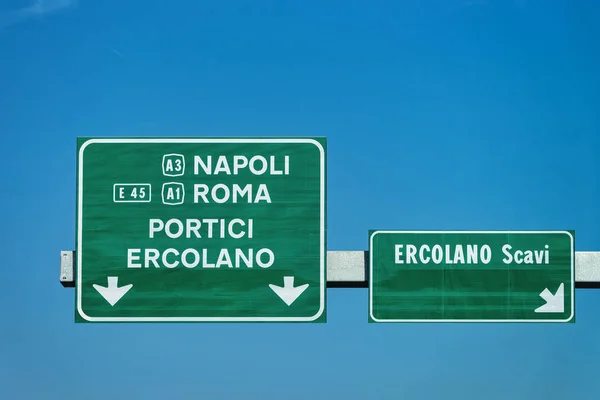 Traffic sign on the road on Rome in Italy. Name of Italian cities are written in Italian.