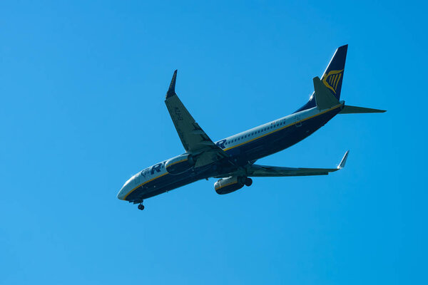 Rome, Italy - October 4, 2017: Ryanair Plane flight in the blue sky. Aircraft travel concept