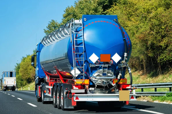 Truck tanker on the road in Italy. Lorry transport delivering some freight cargo.