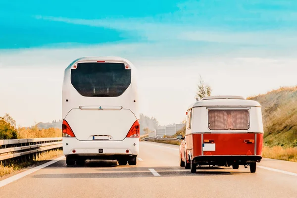 RV Camper Car and Bus on Road. Caravan and motorhome in trip in Switzerland.