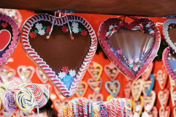 Gingerbread hearts cookies at Christmas Market at Charlottenburg Palace in Winter Berlin, Germany. Advent Fair Decoration and Stalls with Crafts Items on the Bazaar.