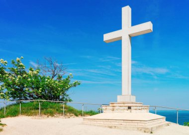 Cross monument at Adriatic sea in the Strunjan National Park of Slovenia clipart