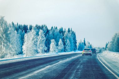 Car in the winter road in Rovaniemi at Lapland in Finland