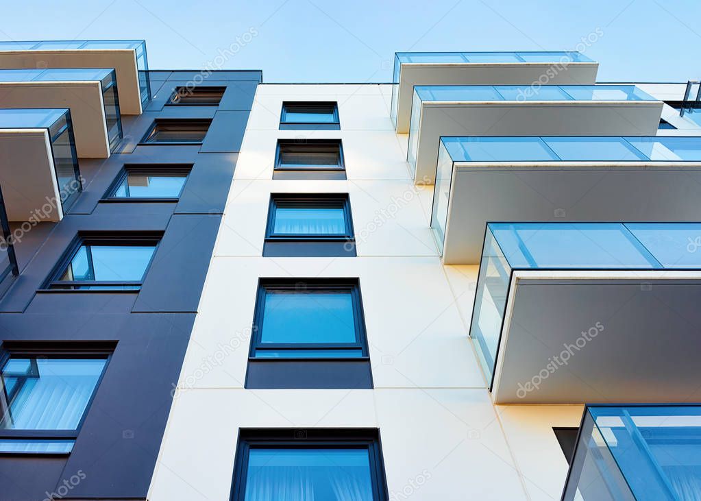 Facade of new modern residential apartment house building. Including place for copy space