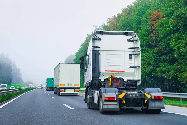 Truck cabin without trailer box in the highway asphalt road in Poland. Truck transporter