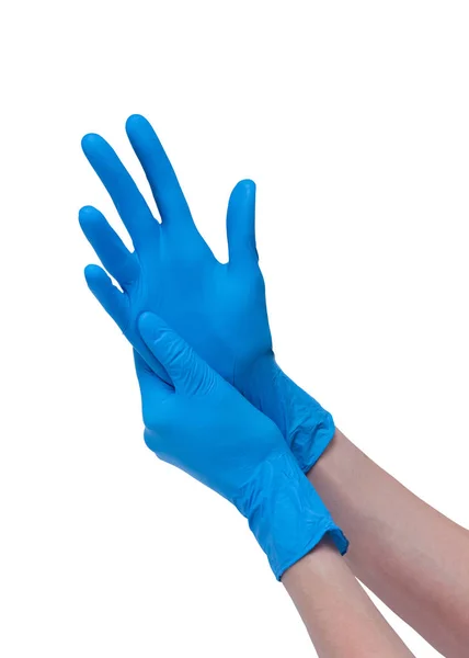 Руки в голубых врачебных латексных перчатках на белом фоне — стоковое фото