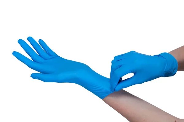 Ręce w niebieskich lateksowych rękawicach medycznych na białym tle — Zdjęcie stockowe