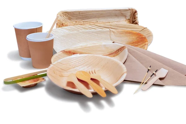 Wooden bamboo disposable tableware with plates and cutlery — Stock Photo, Image