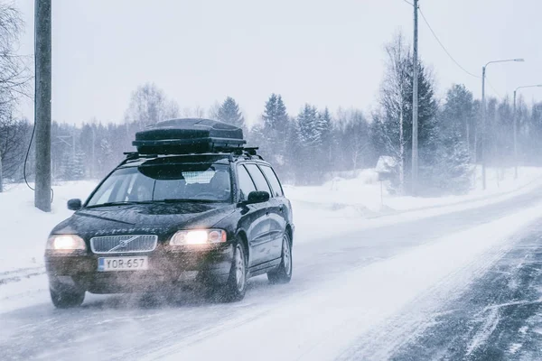 stock image Car with roof rack and winter snowy road Rovaniemi EU