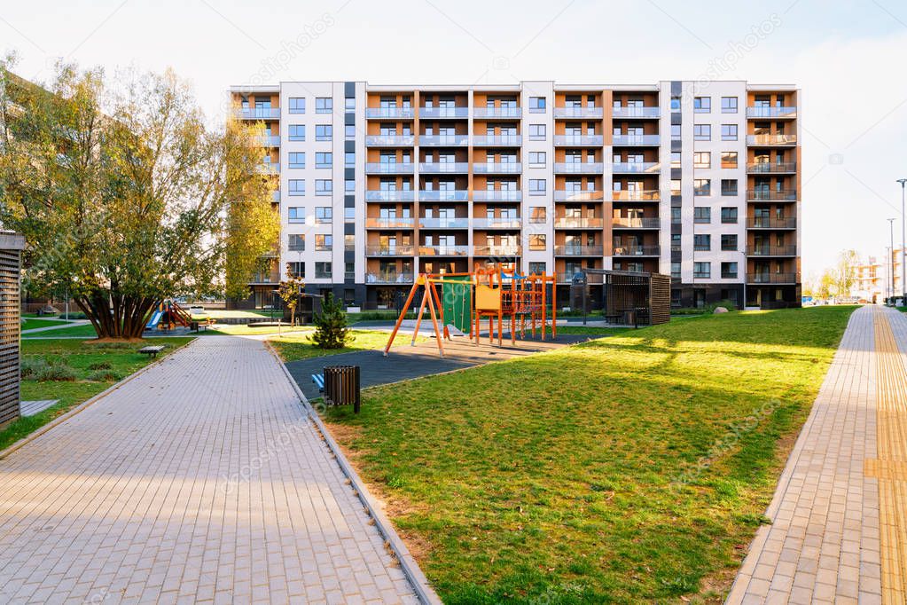 Apartment residential house facade architecture with kids playground
