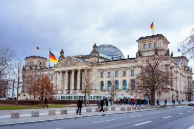 Reichstag building architecture with German flags in Berlin clipart