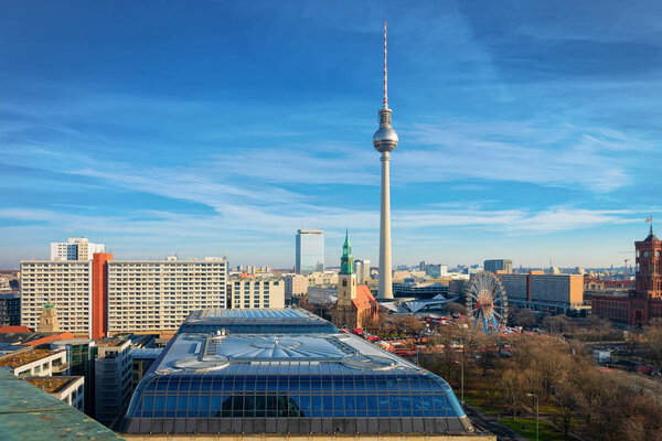 Aerial view on cityscape in German City centre in Berlin with St Mary Church and Fernsehturm tv tower of Germany in Europe. Building architecture. Panoramic landscape and landmark. Tourism and holiday