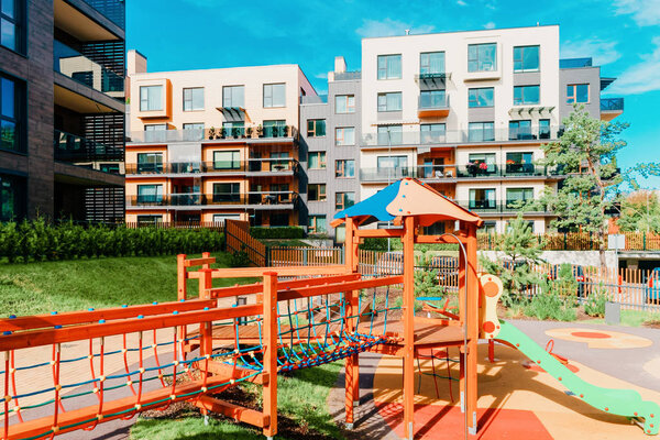 Children playground and European modern residential buildings quarter