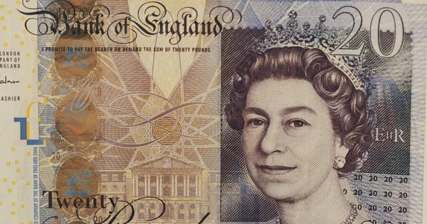 Macro shooting of the portrait of Queen Elizabeth on the pound bill. Close up — Stock Photo, Image