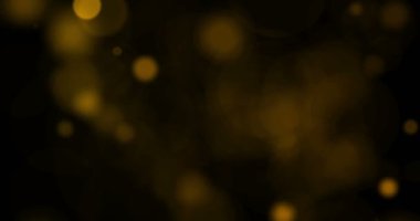 soyut dairesel altın parıltılı parıltı siyah üzerine akan hareket