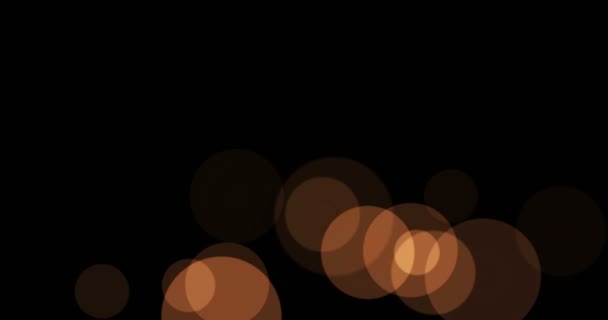 Gold glow particles bokeh flowing effect on black background, holiday happy new — Stock Video