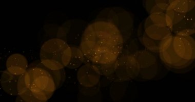 soyut altın kızdırma parçacıklar bokeh siyah arka plan üzerinde etkisi akan, tatil mutlu yeni yıl