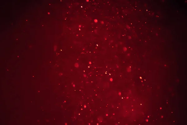Natale luce rossa brillare che scorre in particelle orizzonte bokeh loo — Foto Stock
