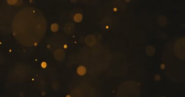 soyut altın kızdırma parçacıklar bokeh siyah arka plan üzerinde etkisi akan, tatil mutlu yeni yıl