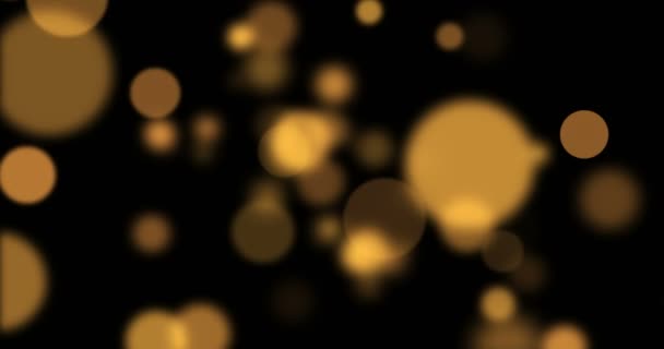 Abstrait circulaire doré scintillement paillettes bokeh mouvement fluide sur noir — Video