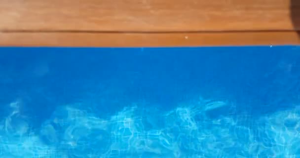 Swimming pool surface caustics ripple like sea water and flow with waves movement — Stock Video