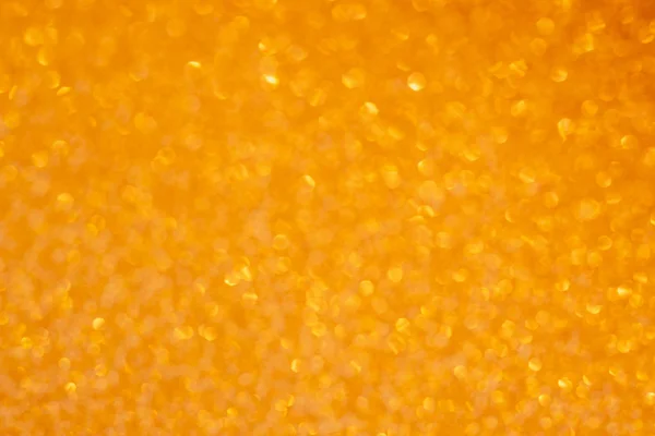Bokeh amarelo alaranjado brilhante texturizado fundo abstrato — Fotografia de Stock