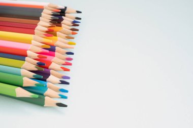banner multicolored pencils on a soft blue background. Set of colorful pencils on soft focus background. Back to school concept.