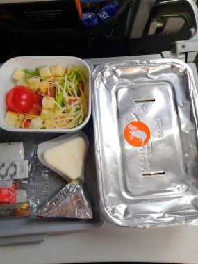 MOSCOW - 06, 2019: food on the plane on an Aeroflot flight pork with rice during flight, Aeroflot is largest airline in Russia