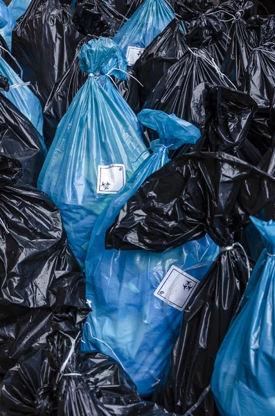 バイオハザード廃棄物医療廃棄物ステッカー ロゴのついたバッグ ロイヤリティフリーのストック画像
