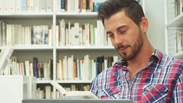 Smart guy is reading a book — Stock Photo, Image