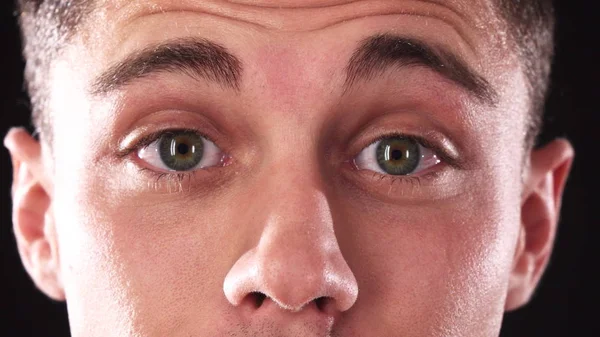 The close-up of the handsome face of a boy who at first is surprised and then smiles — Stock Photo, Image