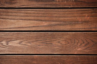 Yıpranmış kahverengi boyalı ahşap tahta yakın çekim