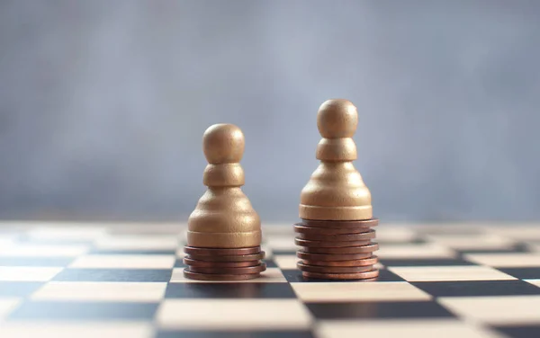 Two Chess Pawns Top Heap Coins — Stock Photo, Image