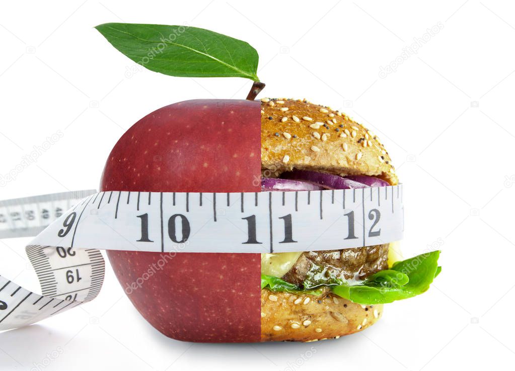 Tape measure aorund a healthy apple and unheatlhy burger merged into one over a white background